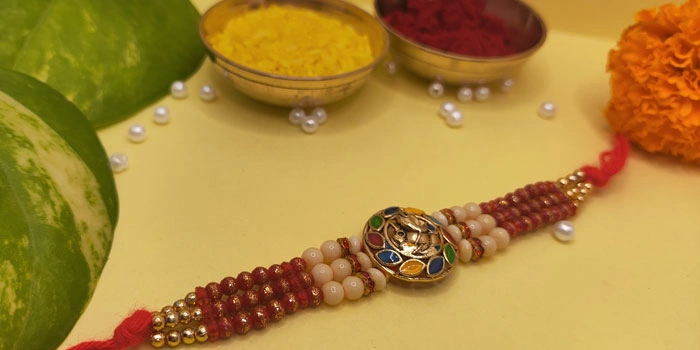 RDS Lord Ganesh Rakhi with a 3-Layer Thread and Roli - Chawal