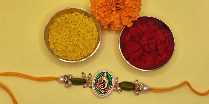 RDS Lord Ganpati Rakhi with Beautiful Ganesh Design and Roli - Chawal