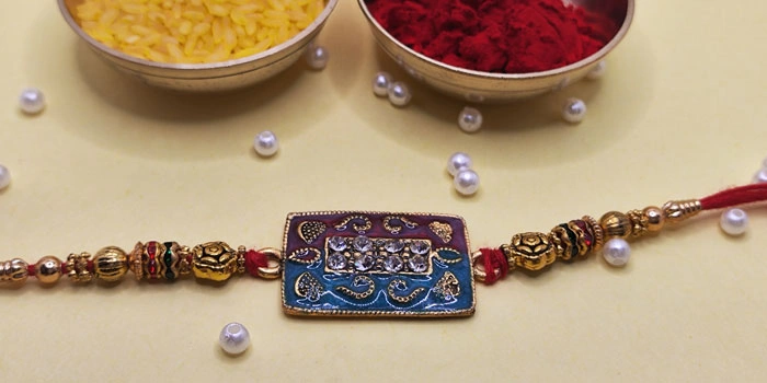 RDS Rectangular Shaped Rakhi with Beautiful Designs and Stones and Roli - Chawal