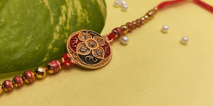 RDS Round Shaped Rakhi with Colorful Design and Stones and Roli - Chawal